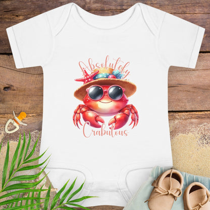 White baby onesie with a red crab design wearing sunglasses and a hat with text Absolutely Crabulous.