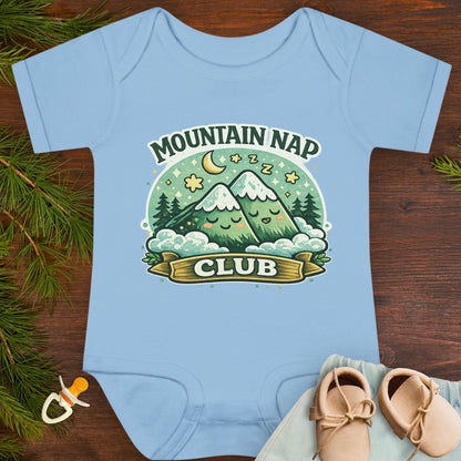 Baby onesie with 'Mountain Nap Club' design with cartoon mountains.