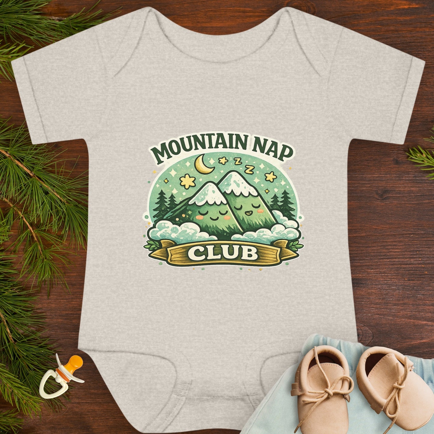 Gray baby onesie with 'Mountain Nap Club' design with cartoon mountains.