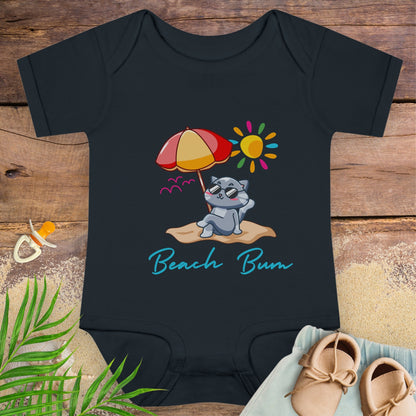 Black baby beach bum onesie with a beach-themed design featuring a cat, umbrella, and sun. 