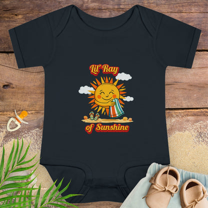 Black baby onesie with smiling sun beach graphic and text “Lil’ Ray of Sunshine.