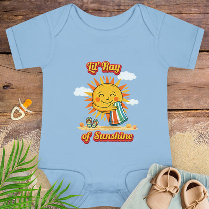 Baby onesie onesie with smiling sun beach graphic and text “Lil’ Ray of Sunshine.