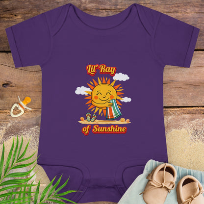 Purple baby onesie onesie with smiling sun beach graphic and text “Lil’ Ray of Sunshine.