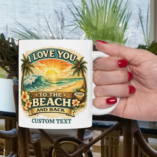 Mug with 'I Love You to the Beach and Back' design held by a hand with red nail polish.