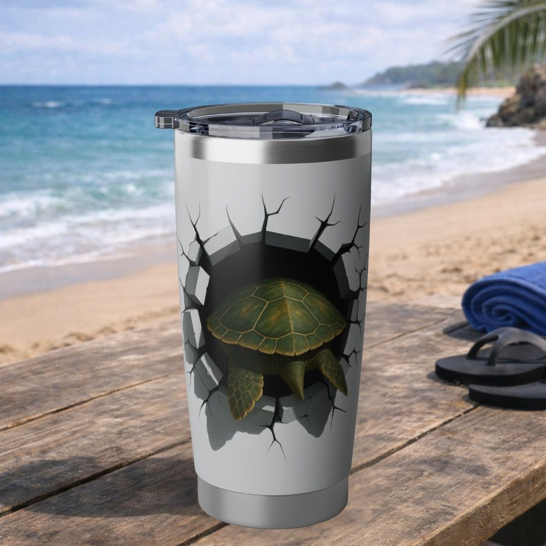 Tumbler with sea turtle design on a beach setting