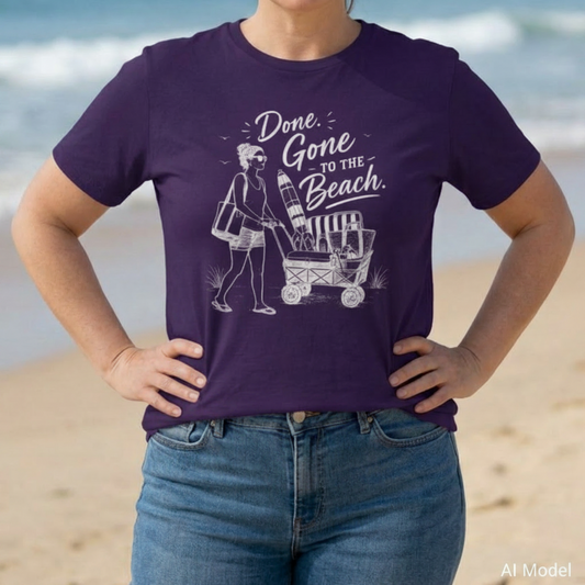 Purple unisex t-shirt with a woman pushing a cart of beach equipment and text "Done. Gone to the Beach."