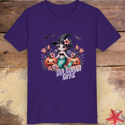 Purple kids t-shirt with “Boo Lagoon Cutie” text, a cute witchy mermaid, pumpkins, bats, and flowers.