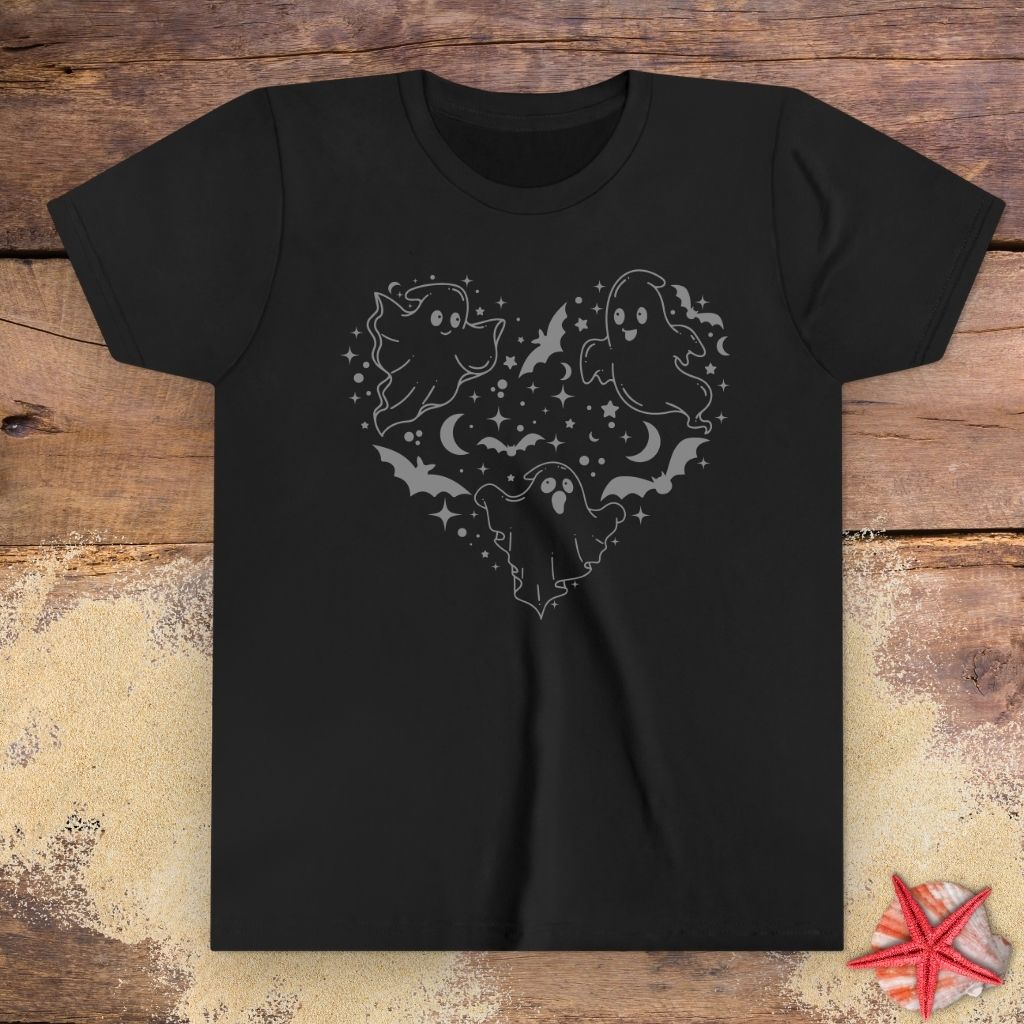Black youth t-shirt with black ghost heart design featuring cute ghosts, bats, stars, moons, and spooky Halloween line art.