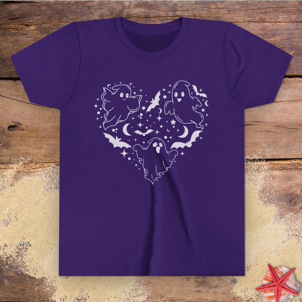 Purple youth t-shirt with black ghost heart design featuring cute ghosts, bats, stars, moons, and spooky Halloween line art.