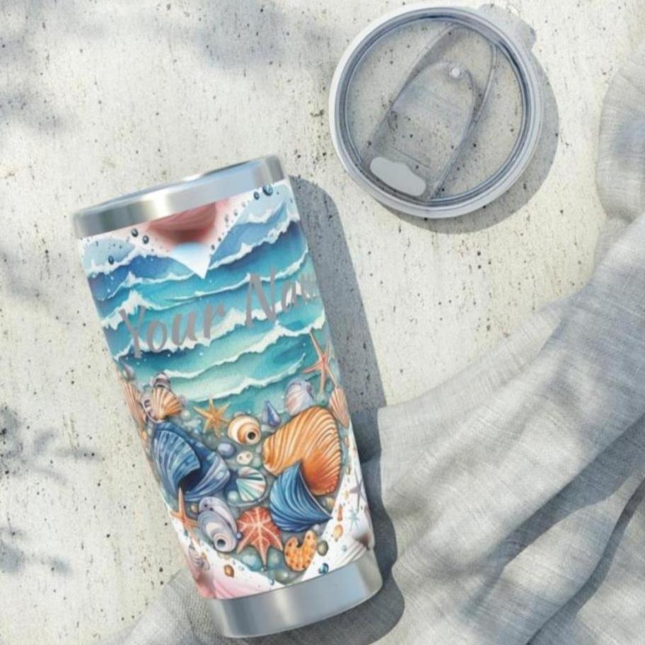 20 oz stainless steel tumbler with ocean wave heart on seashell background with personalized name.