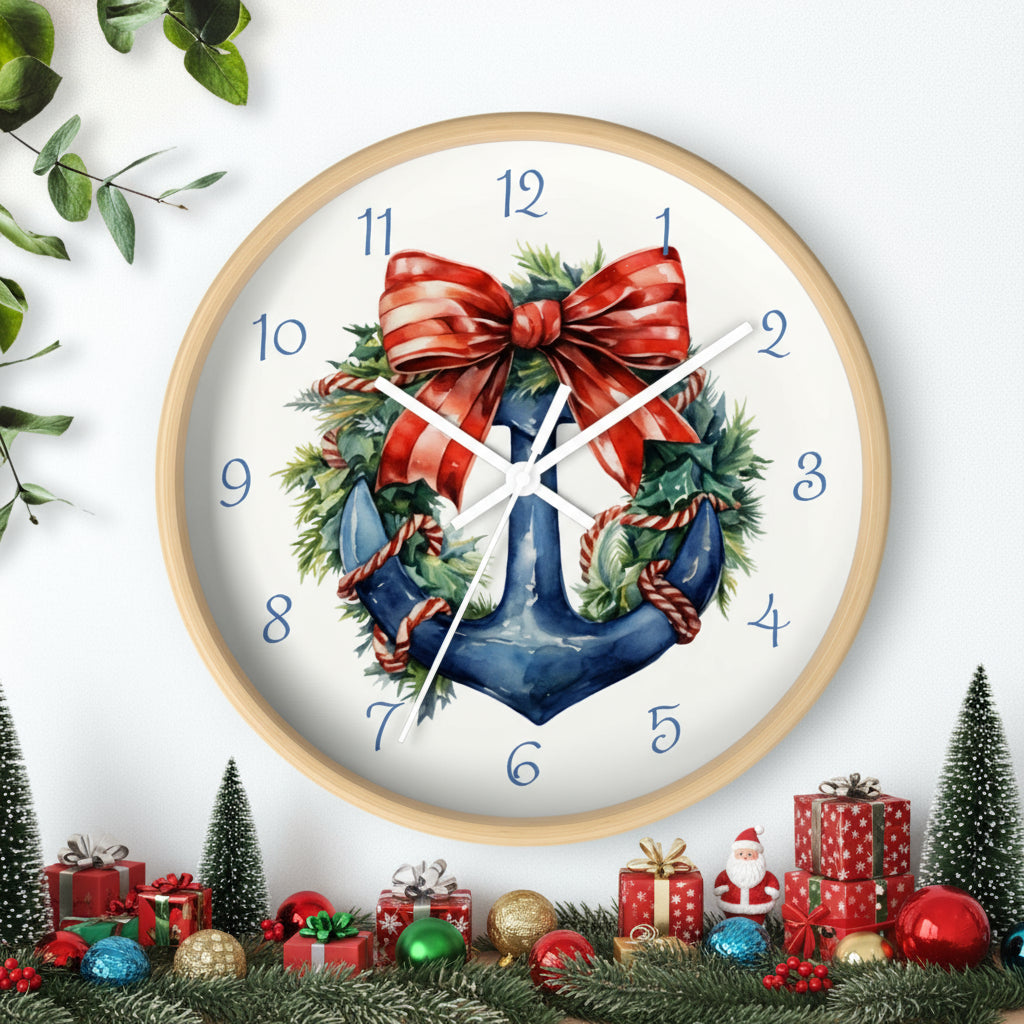 Decorative wall clock with a Christmas design featuring an anchor, bow, and wreath on a white background.