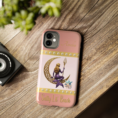 Phone case with mermaid design on a wooden surface
