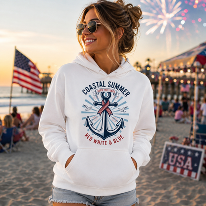Woman wearing a white hoodie with an anchor design on a beach with fireworks in the background