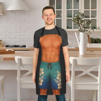 Man wearing a funny black apron with man surfer body wearing tropical blue shorts.