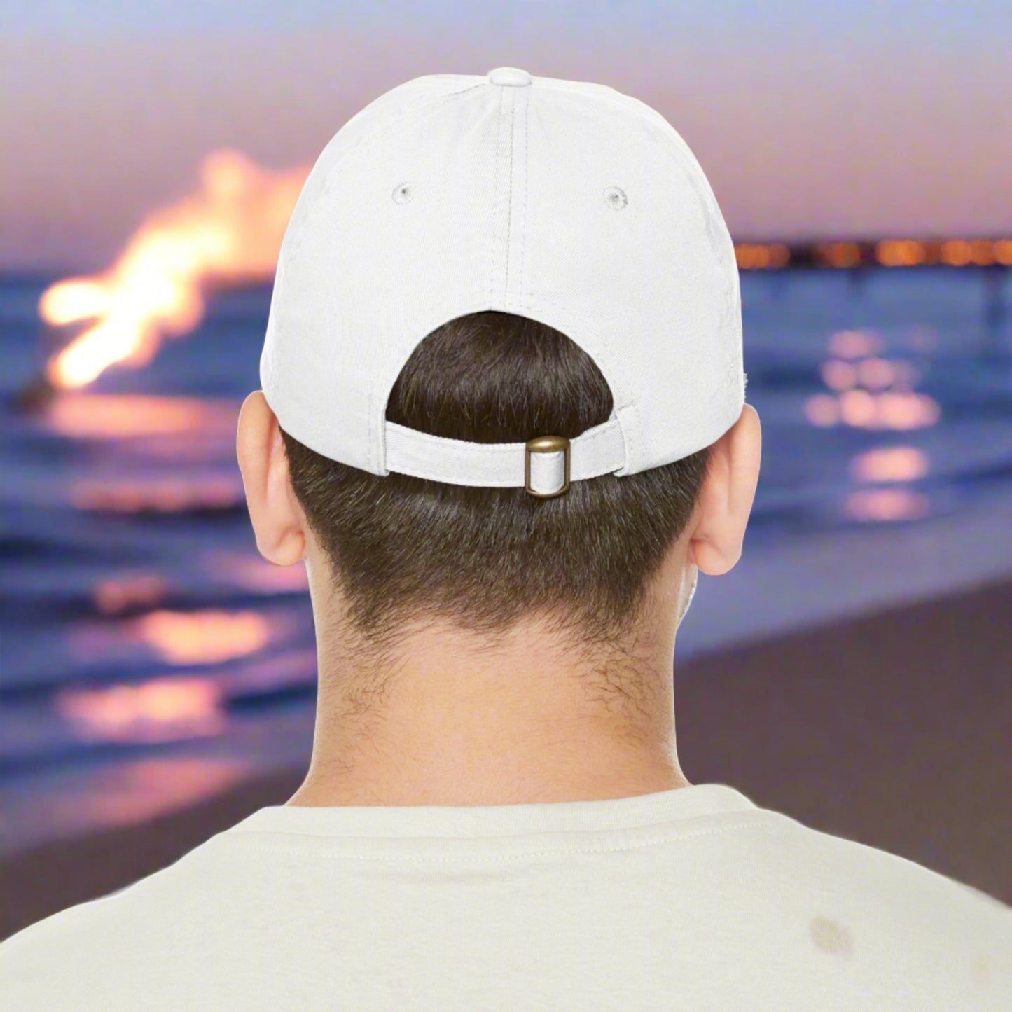 the back of a white ball cap hat with metal buckle