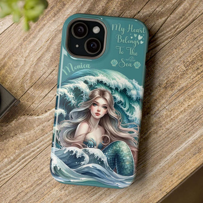 Phone case with mermaid design on a wooden surface