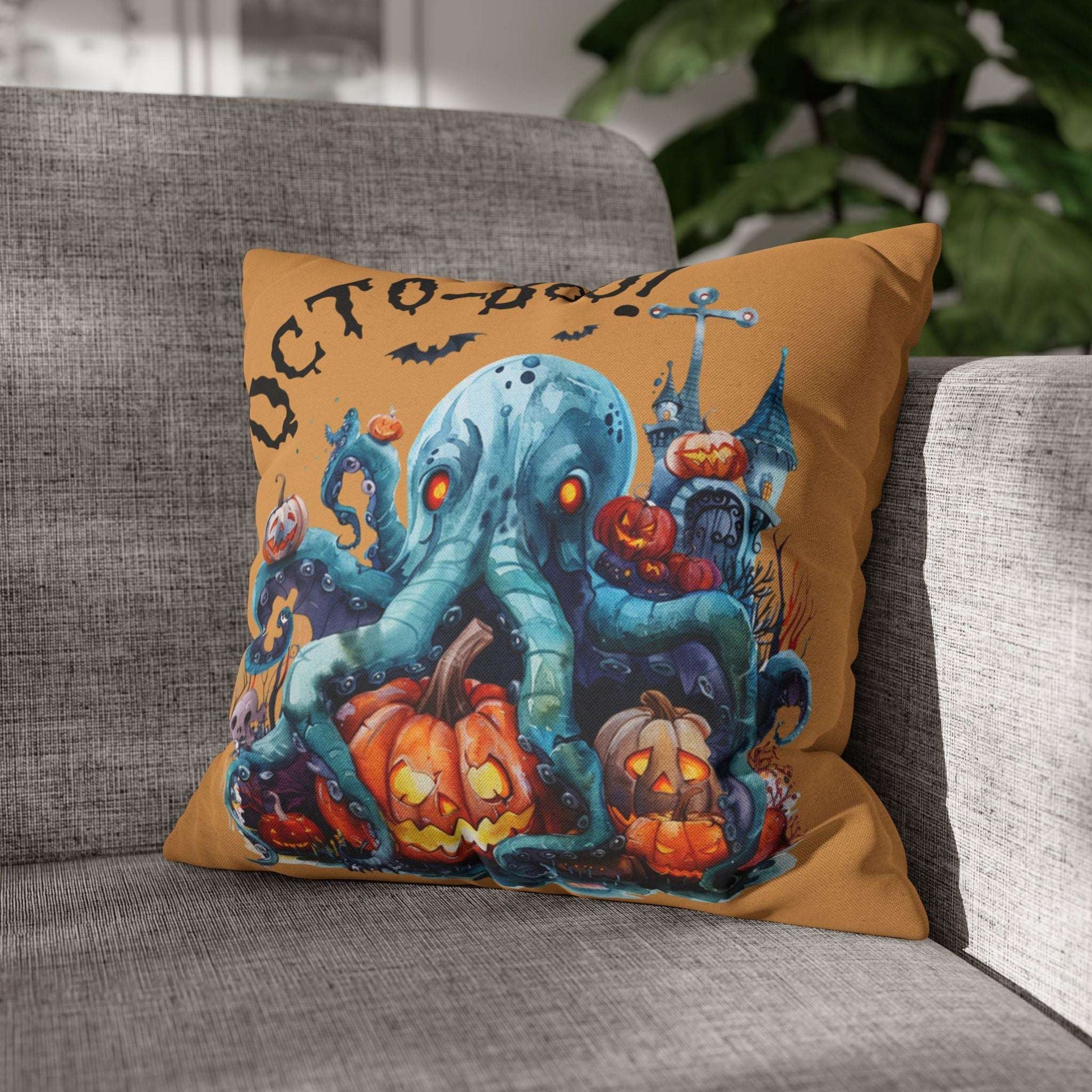 Halloween-themed pillow with an octopus and pumpkins on a gray couch.