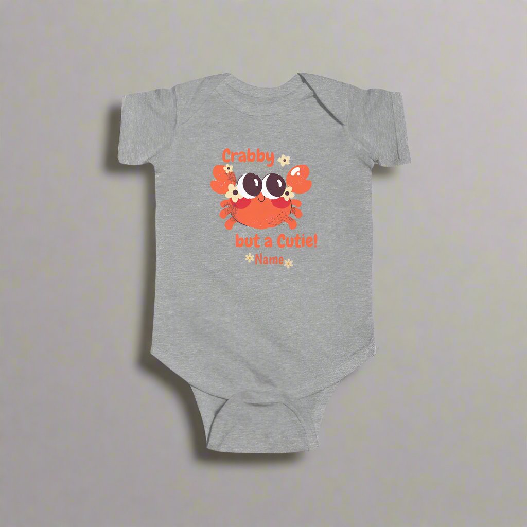 Gray short-sleeved bodysuit with cartoon crab that says crabby but a cutie with a space for a personalized name below.