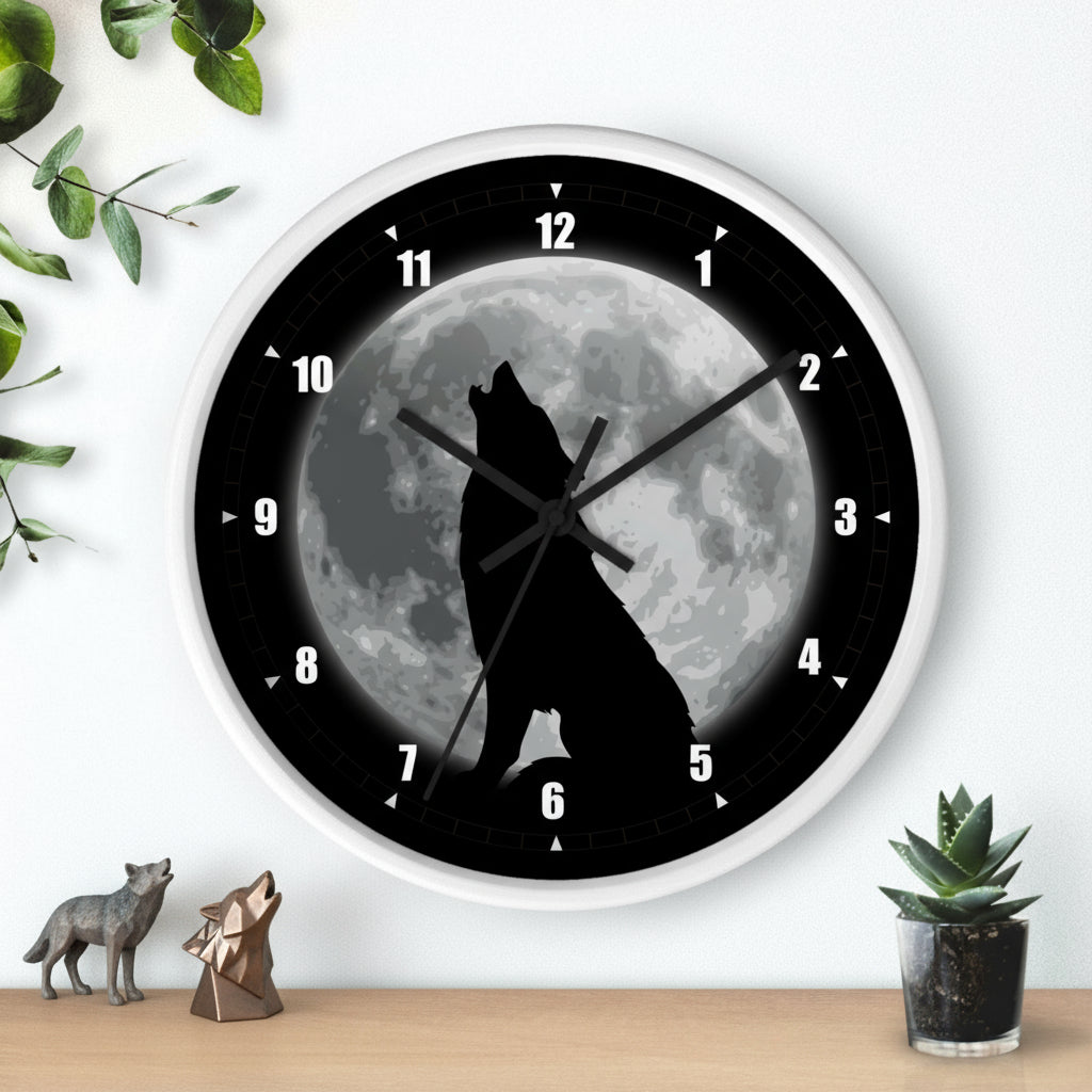 Wall clock with a wolf howling at the moon design on a white wall.