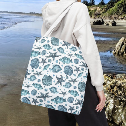 18" x 18" Tote bag with white strap and an all-over blue seashell, starfish, and fish pattern on a white background with white handles.