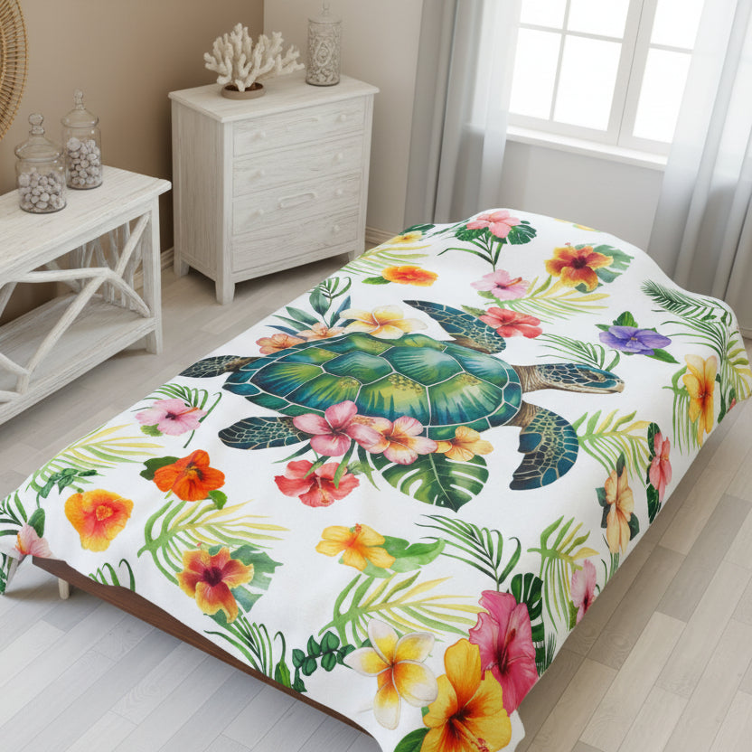 Cozy tropical velveteen 60x80 throw blanket featuring a sea turtle surrounded by colorful hibiscus flowers and palm leaves, perfect for beachy home decor.