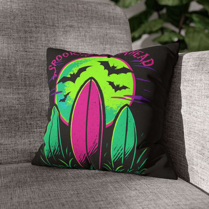 Decorative pillow with Halloween design on a gray couch
