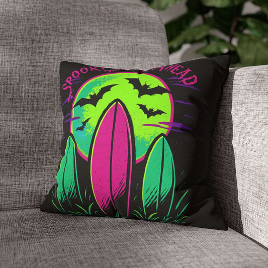 Decorative pillow with Halloween design on a gray couch