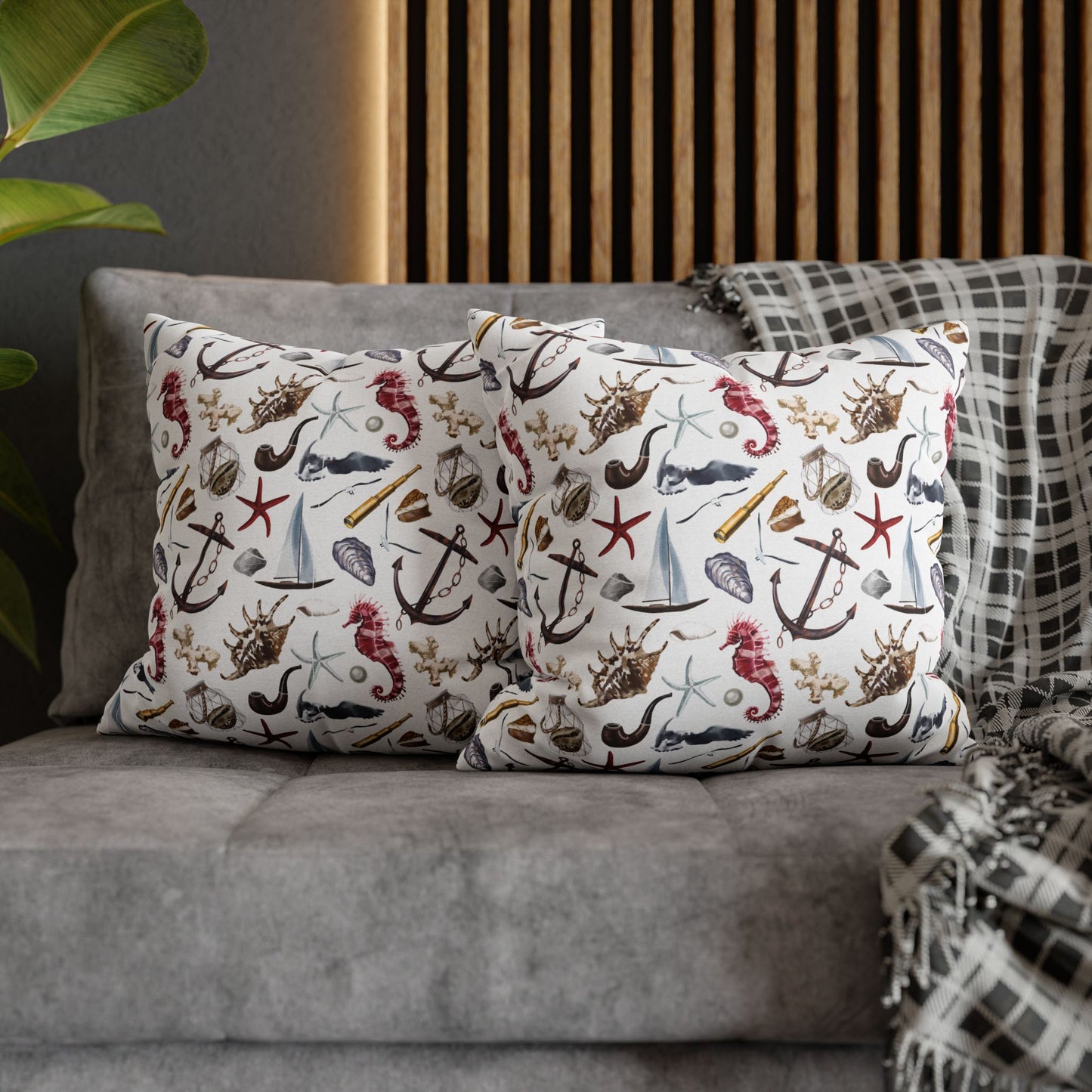 Two 18" x 18" white pillowcases featuring detailed graphics of anchors, seashells, sailboats, and seahorses in a nautical-themed pattern.