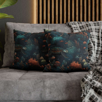 16" x 16" two decorative pillows with underwater scene with sea turtles on a gray couch.