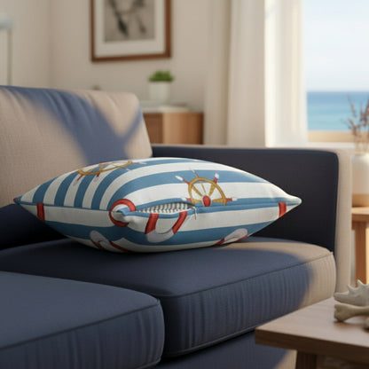 Decorative pillow with nautical design featuring a life buoy and ship wheel on a white background
