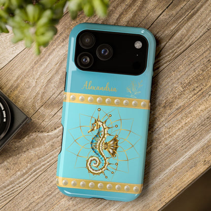 Turquoise phone case with gold seahorse design on a wooden surface