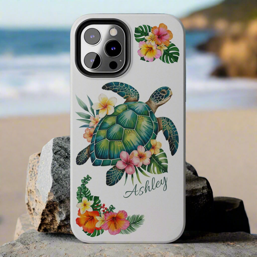 iPhone 12 case with a white background and a sea turtle with hibiscus flowers, with more hibiscus flowers around the sides.