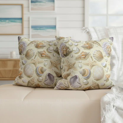Decorative pillows with shell pattern on a gray sofa