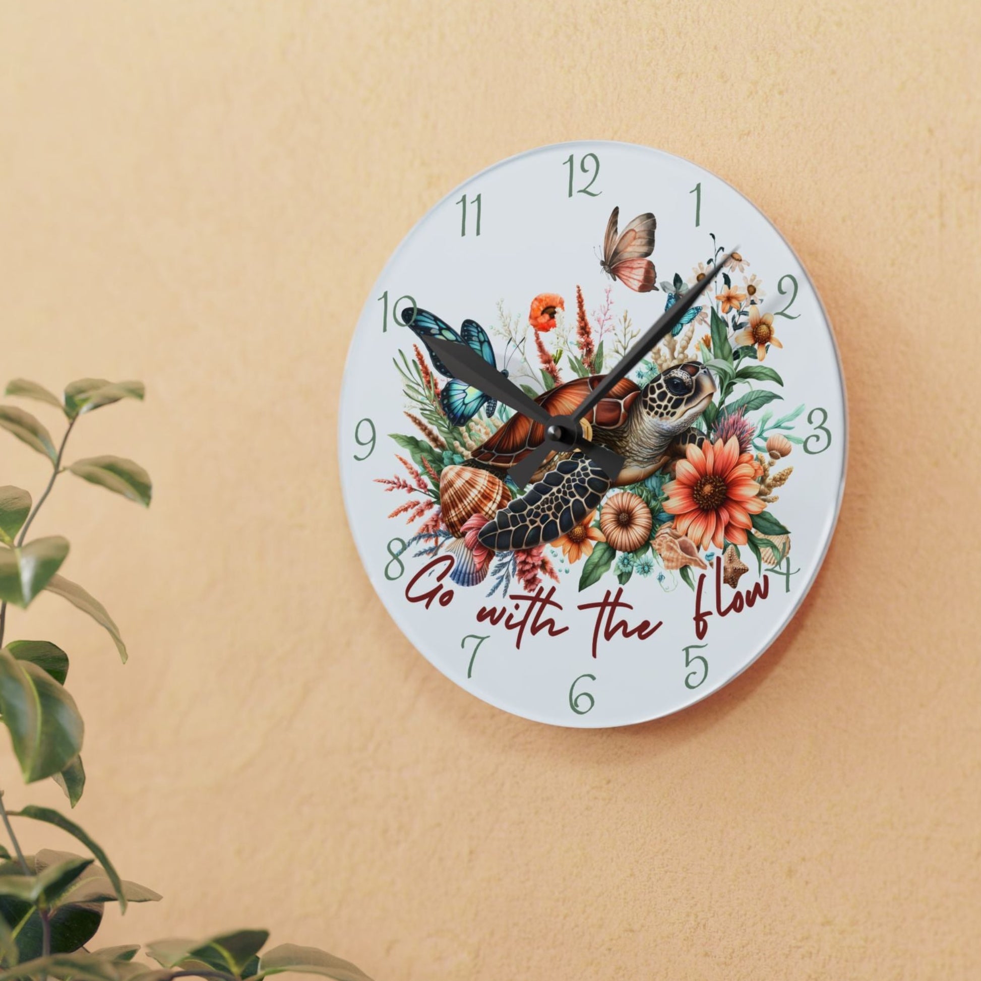 Decorative wall clock with sea turtle and floral design with text Go with the Flow.