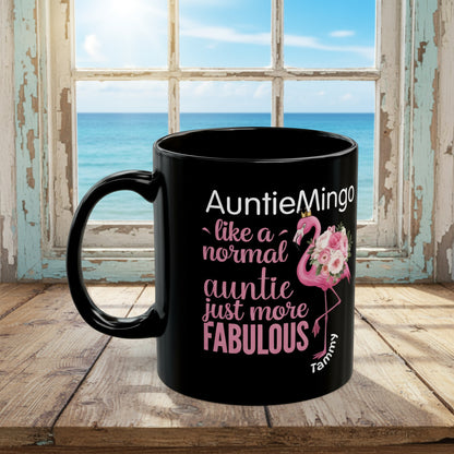 Black mug with pink flamingo and text design on a white background