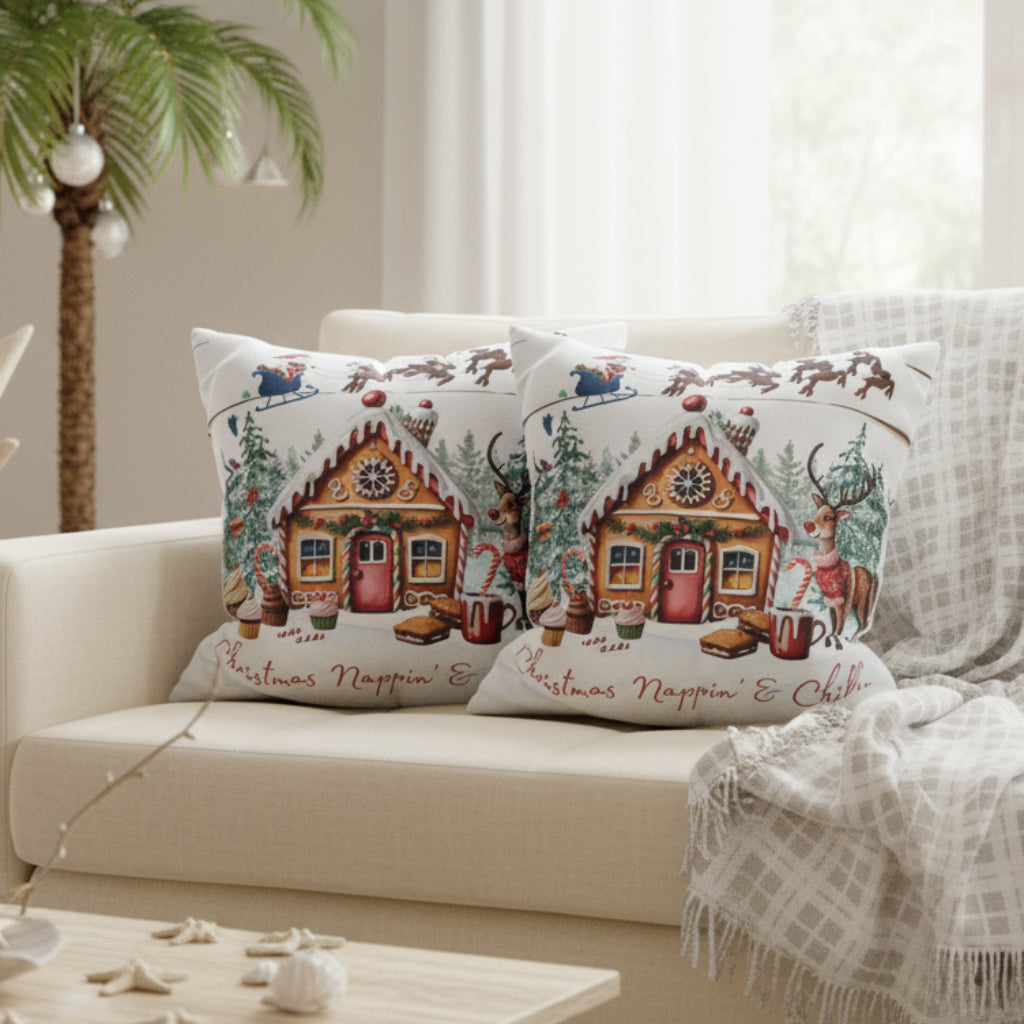 Decorative pillows with gingerbread house design on a sofa
