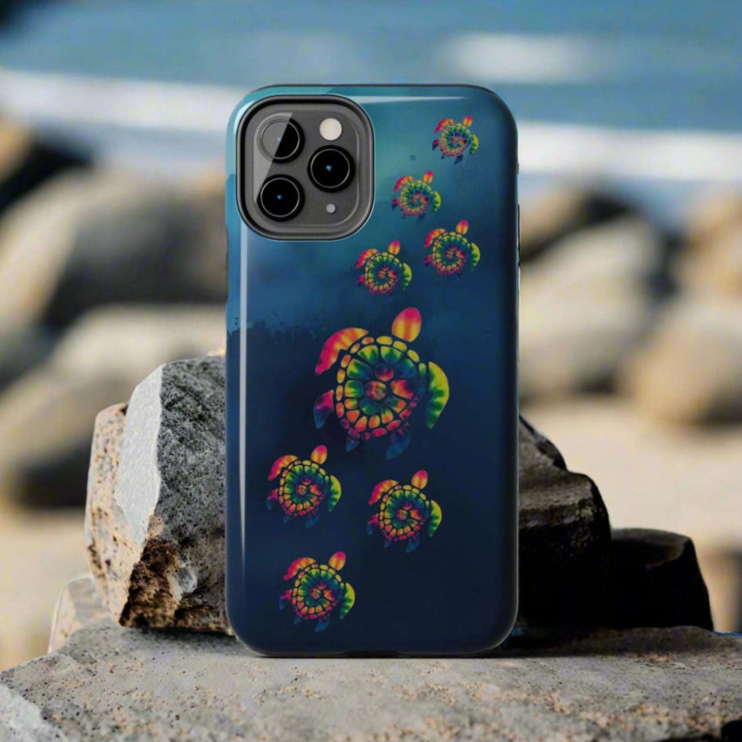 Phone case with colorful spiral design on a gray background