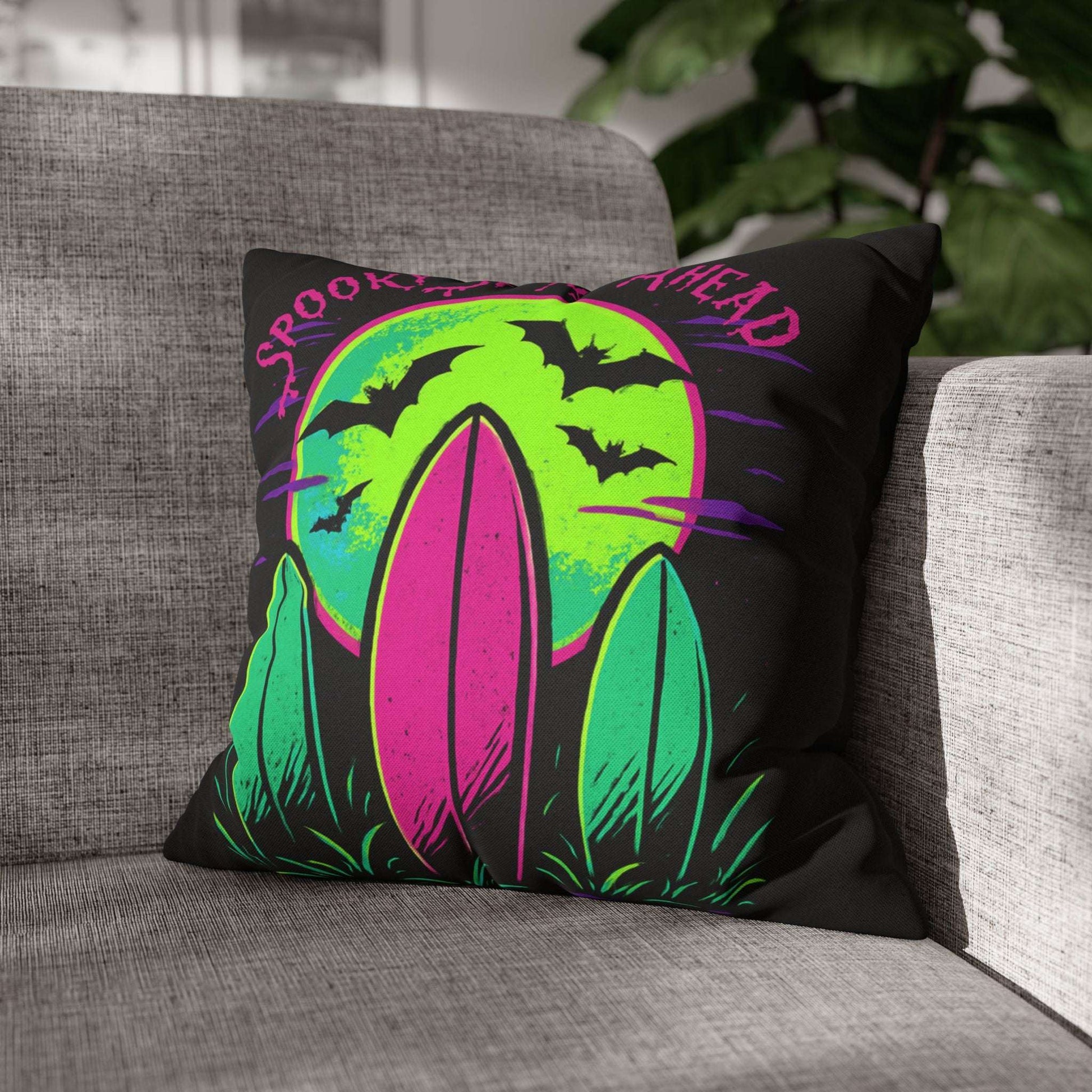 Decorative pillow with Halloween design on a gray couch