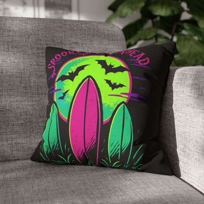 Decorative pillow with Halloween design on a gray couch