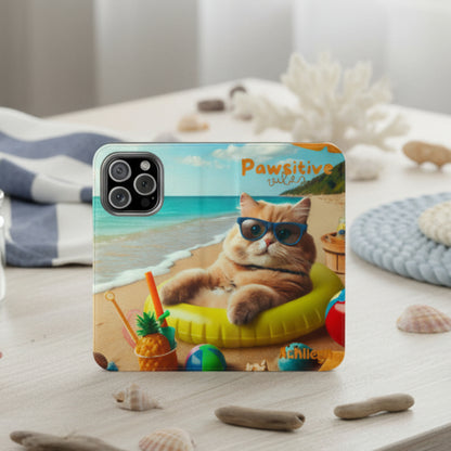 Flip phone case with an illustration of a cat lying in an inner tube on the beach with the text “Pawsitive Vibes,” customizable with a name.