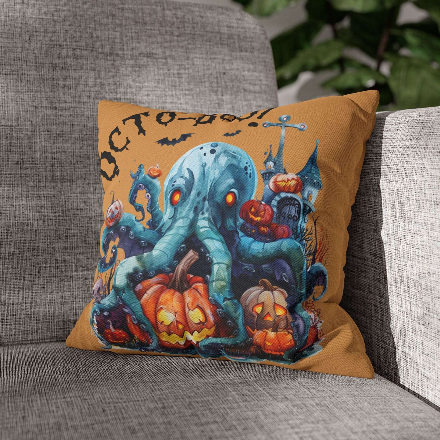 Halloween-themed pillow with an octopus and pumpkins on a gray couch.
