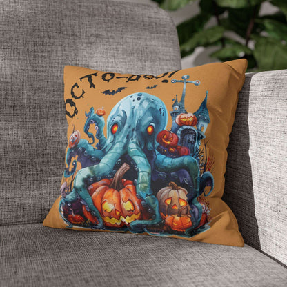 Halloween-themed pillow with an octopus and pumpkins on a gray couch.
