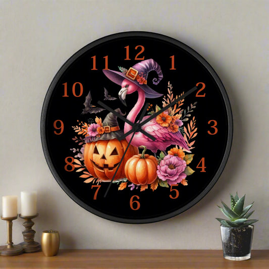 Halloween-themed wall clock with flamingo, pumpkins, and flowers on a black background.