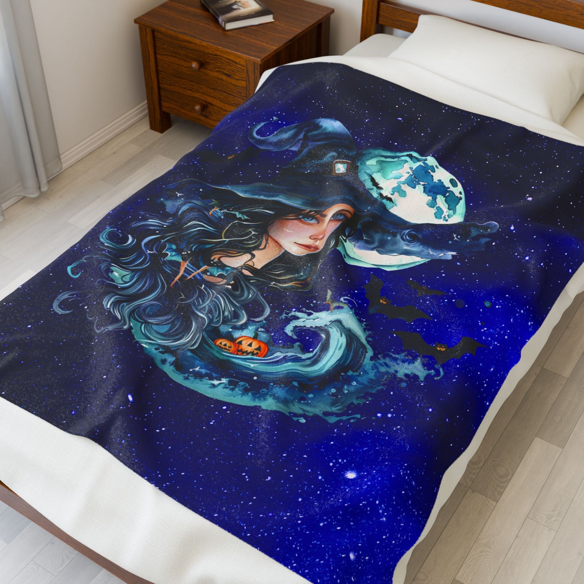 Halloween plush 50" x 60" blanket with witch, ocean wave, pumpkins, and full moon in starry sky.