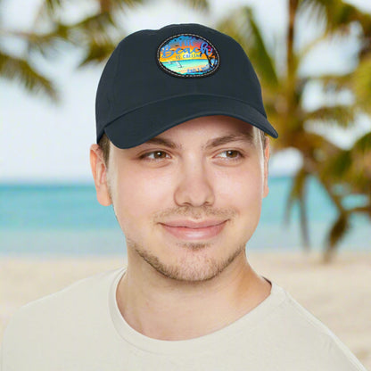 Navy hat with a leather patch with picture of beach scene and text The beach is calling and I must go.