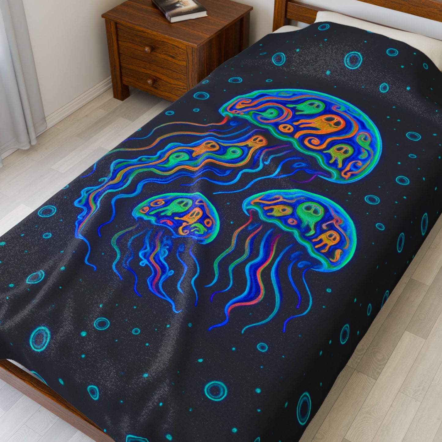 Pop art jellyfish 60" x 80" plush blanket with pumpkins inside and water bubbles on black background.