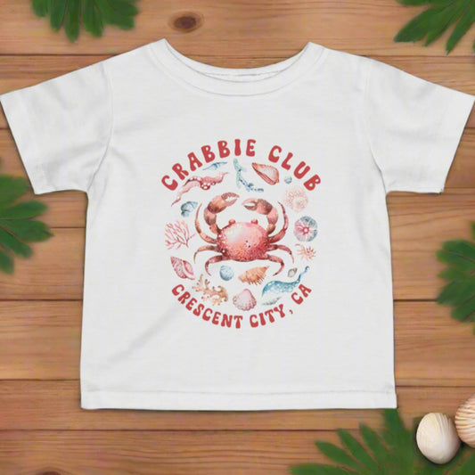 White t-shirt with a crab graphic and 'Crabbie Club' Crescent City, CA.