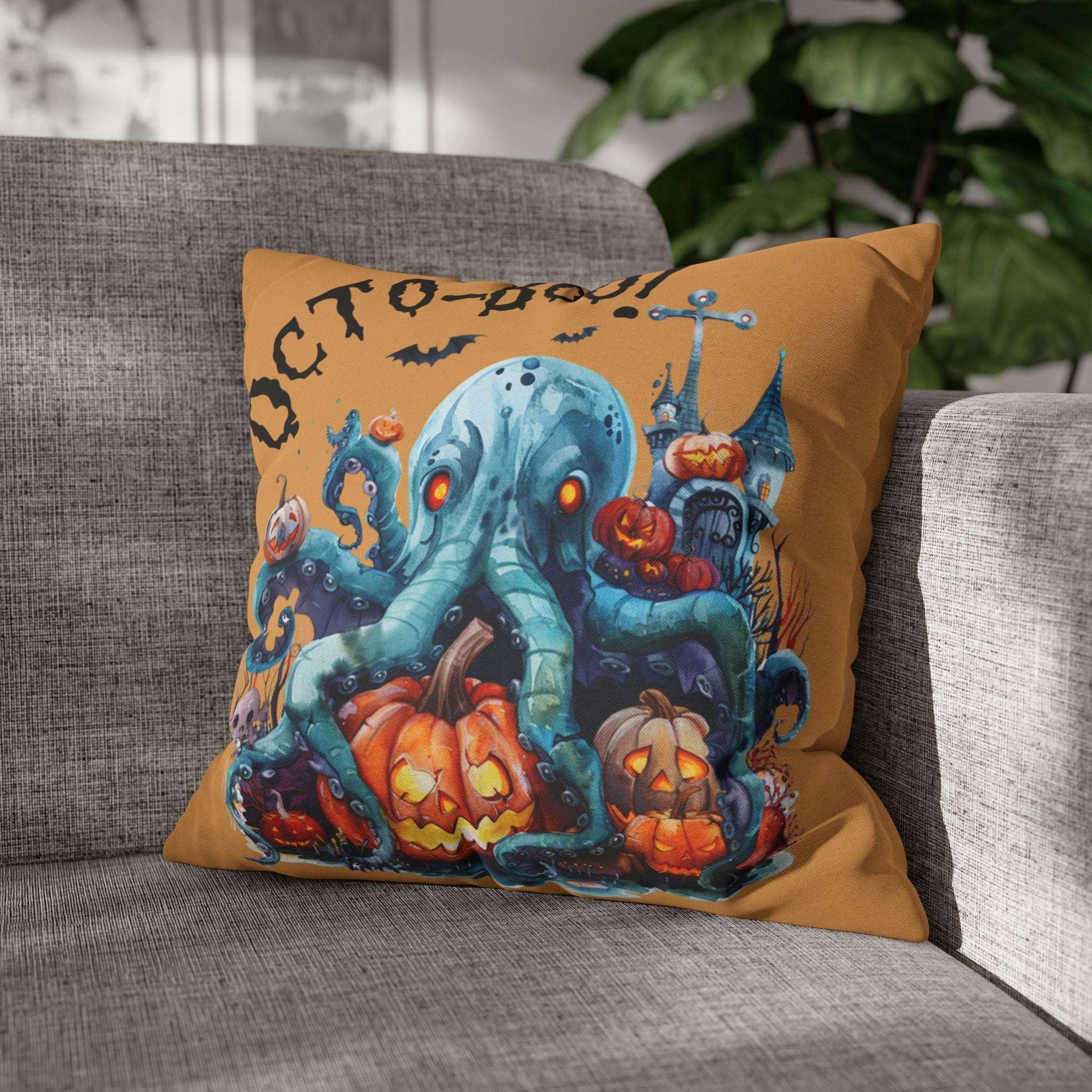 Halloween-themed pillow with an octopus and pumpkins on a gray couch.