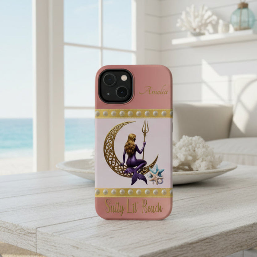 Phone case with a design of a mermaid and crescent moon on a pink background.