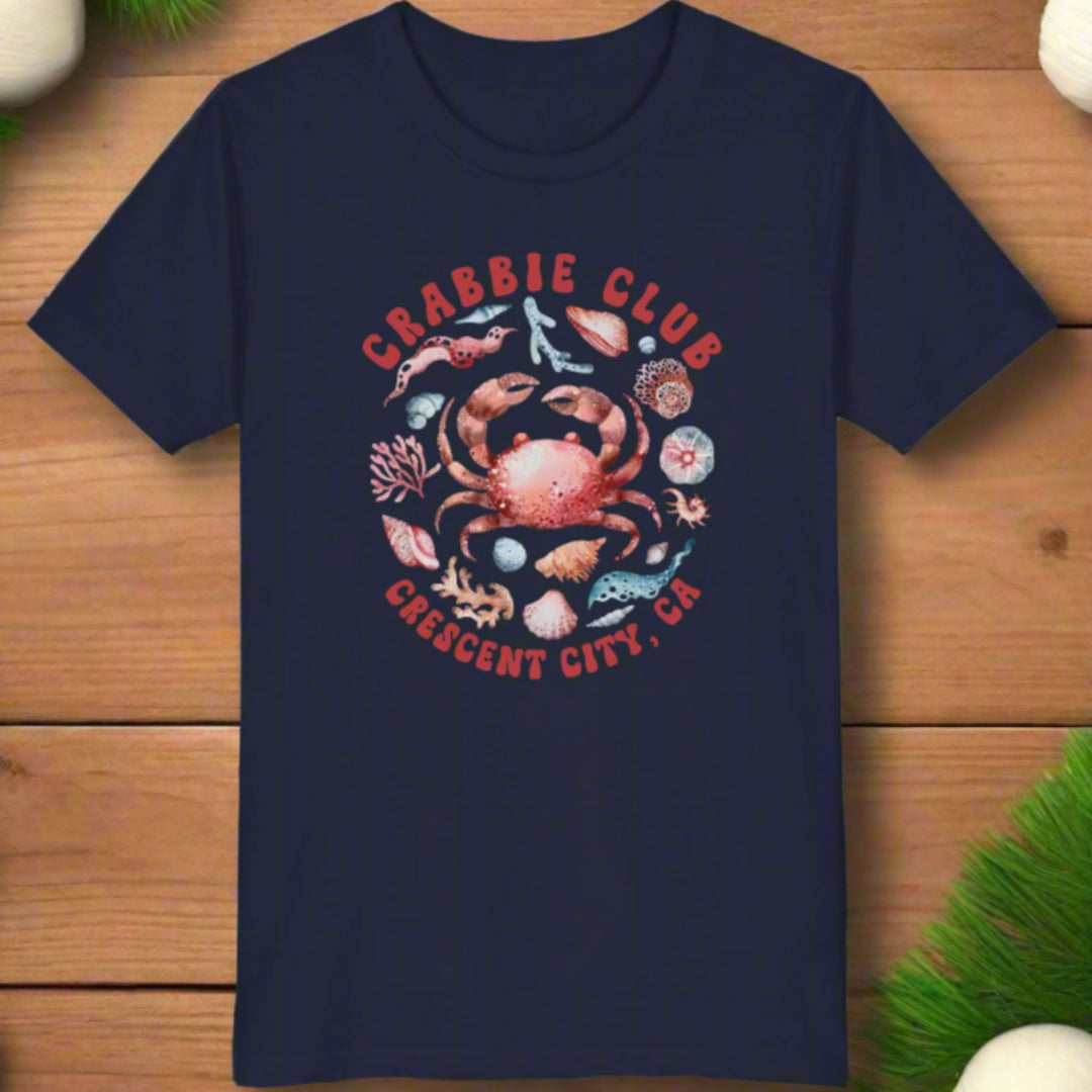 Navy blue t-shirt with a crab graphic and 'Crabbie Club Crescent City, CA' text on a white background